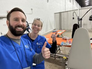 Team giving thumbs up at dental outreach event